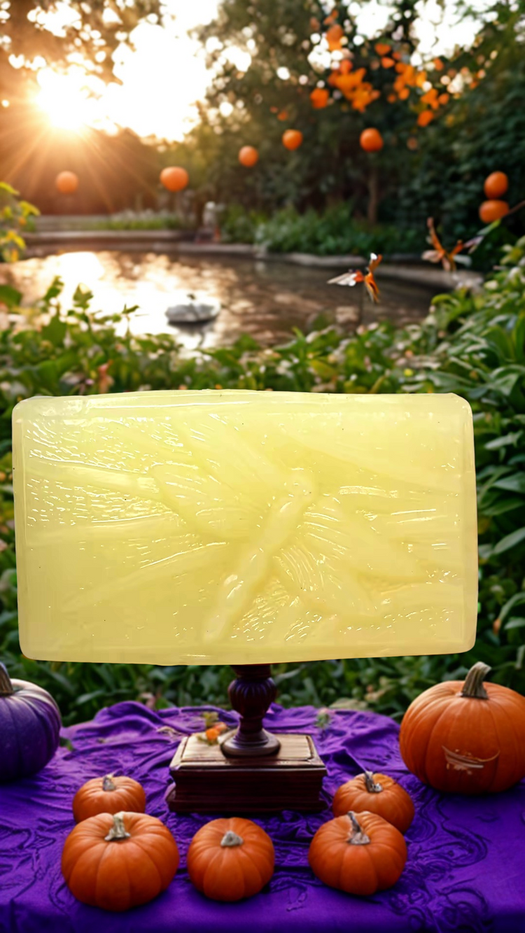 Dragonfly Company Fallen Leaves soap outside with a lake and pumpkins