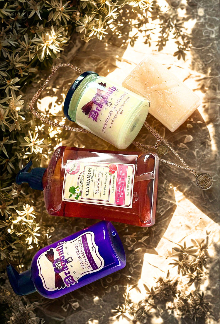Assorted skincare products including bottles and a jar on a textured surface with plants.