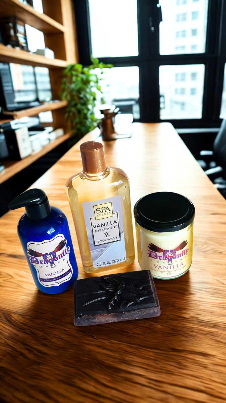 Soap lotion candle body wash and shower puff on a wooden surface with a blurred indoor background.