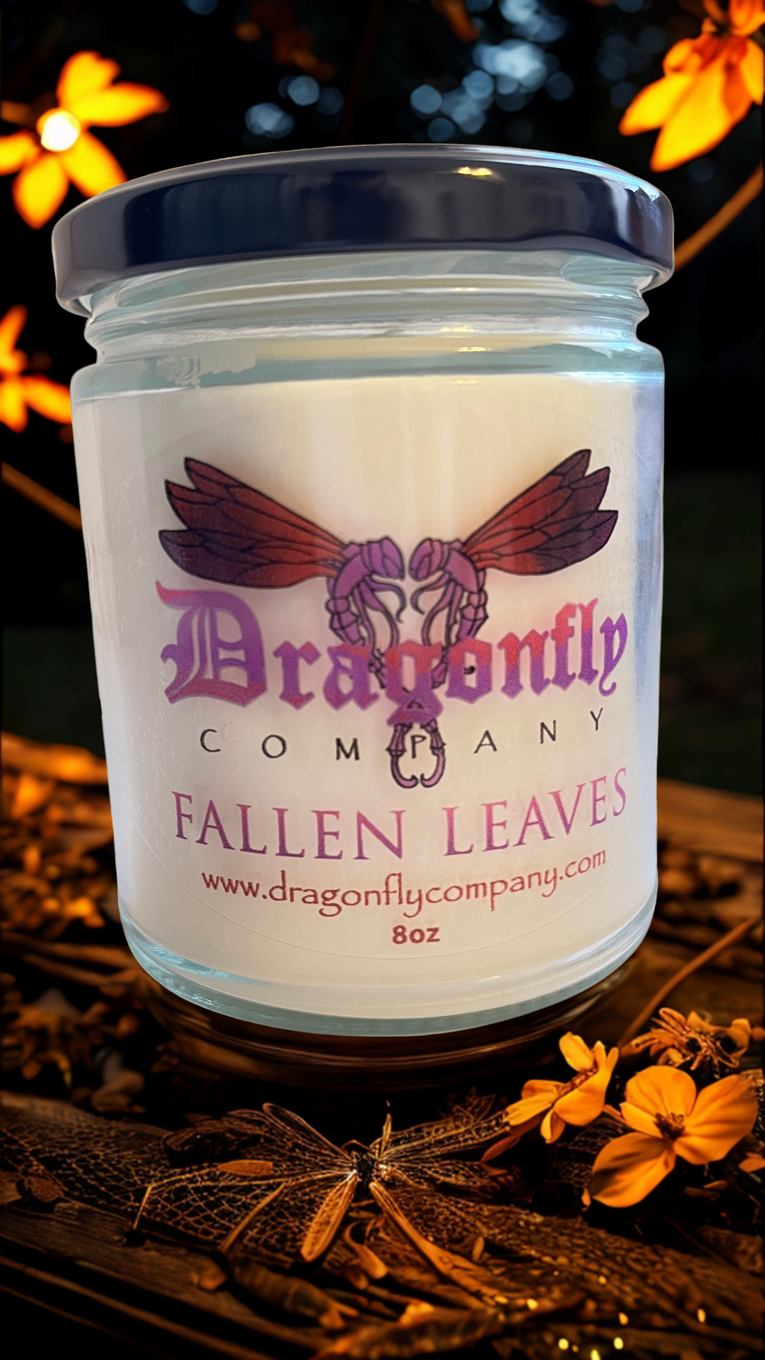 Jar of 'Fallen Leaves' candle from Dragonfly Company with autumn leaves in the background