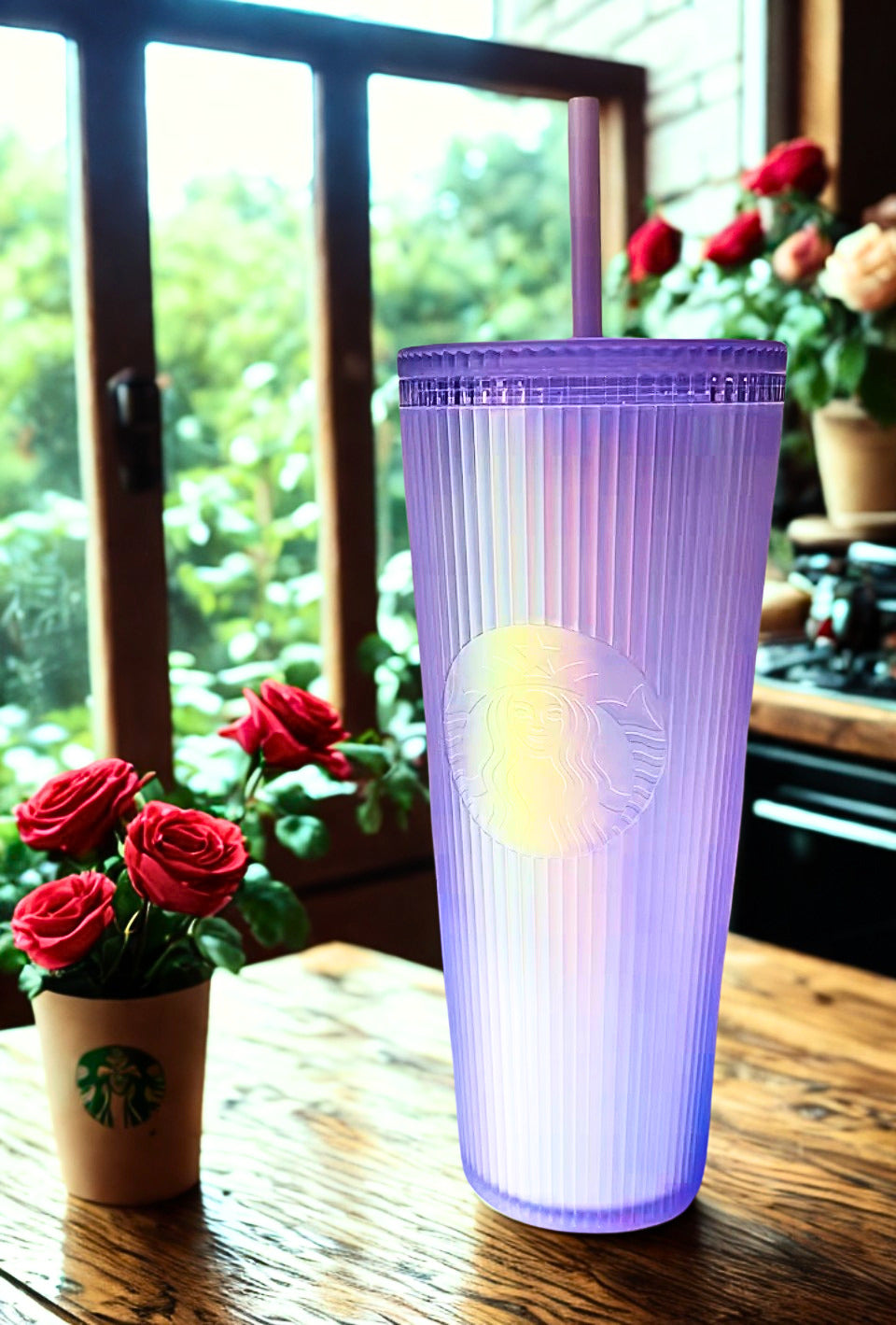 Lavender Starbucks tumbler on a wooden table with Starbucks cup in the background
