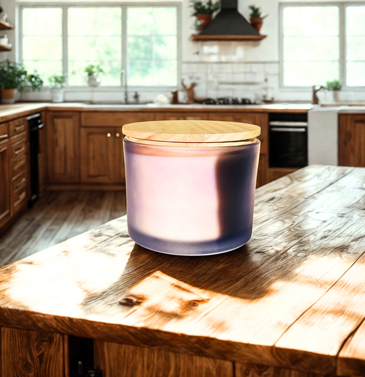 A frosted glass jar with a light wood lid sits on a rustic wooden kitchen island, with a blurred modern kitchen in the background.