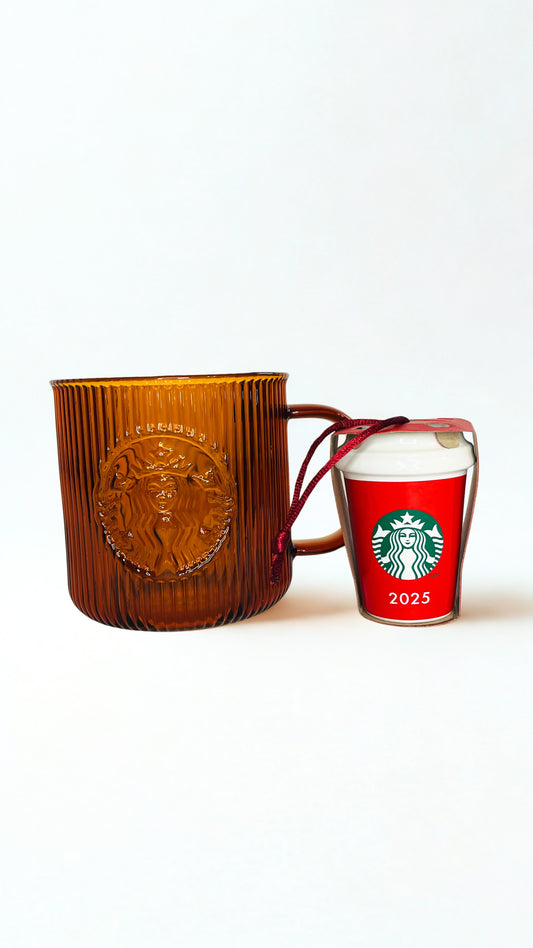 Amber  textured mug and red Starbucks ornament  with 2025 design on a white background
