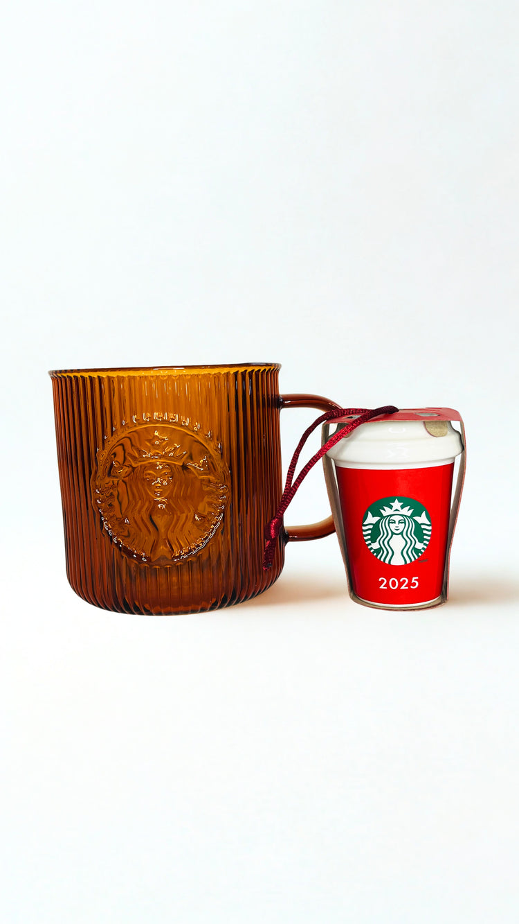 Amber  textured mug and red Starbucks ornament  with 2025 design on a white background