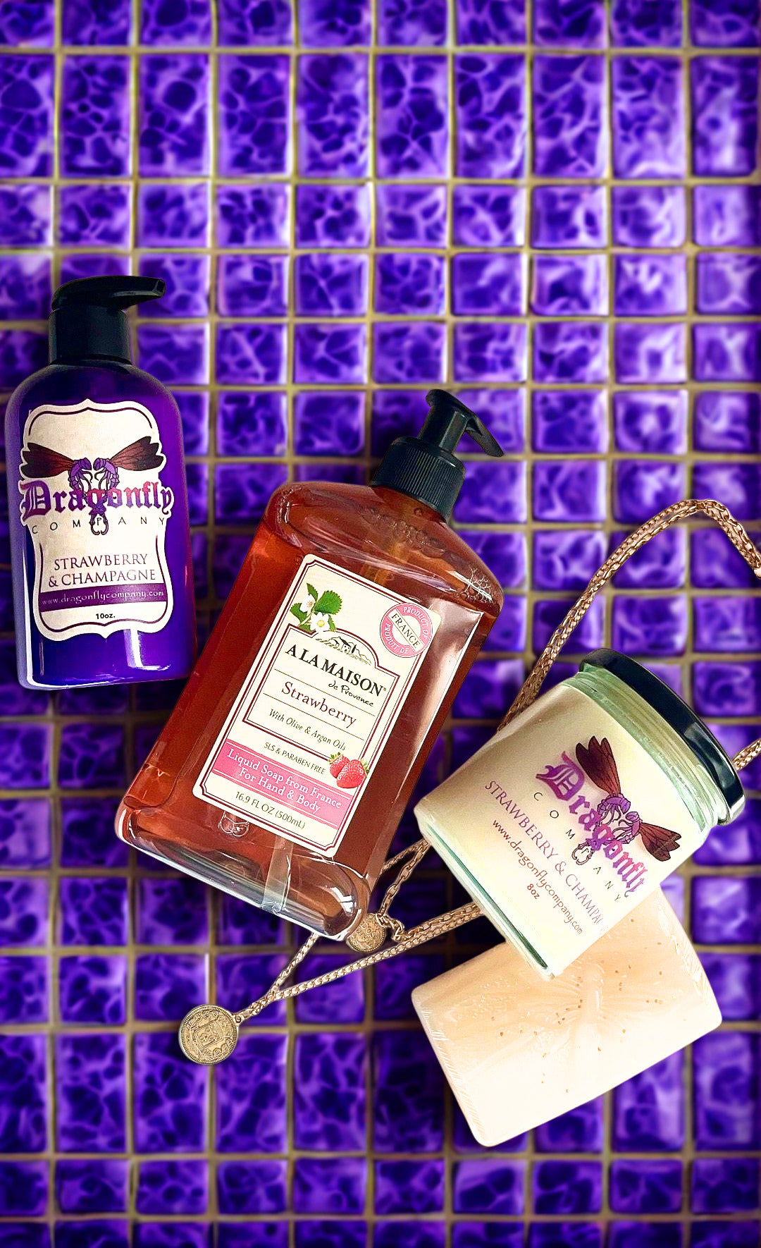 Strawberry and Champagne bundle and a necklace on purple tile 