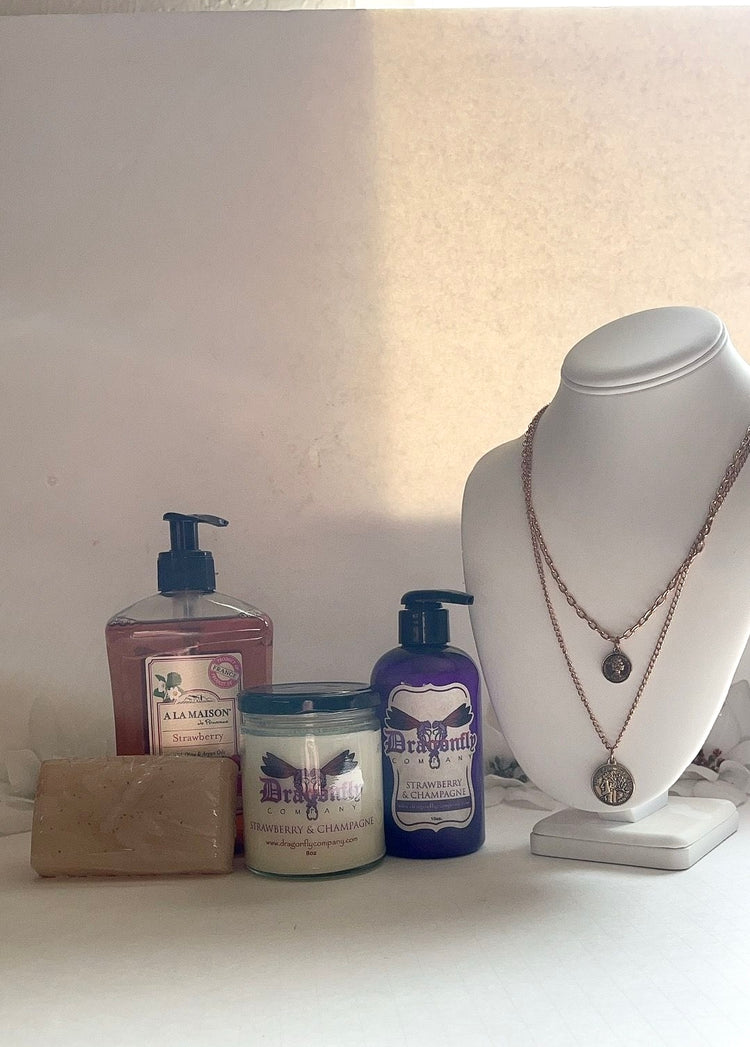 Strawberry and Champagne  products including a necklace  a white surface.