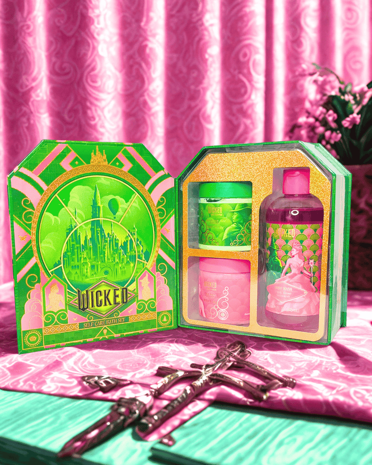 Wicked-themed self care bath  set with packaging on a pink background