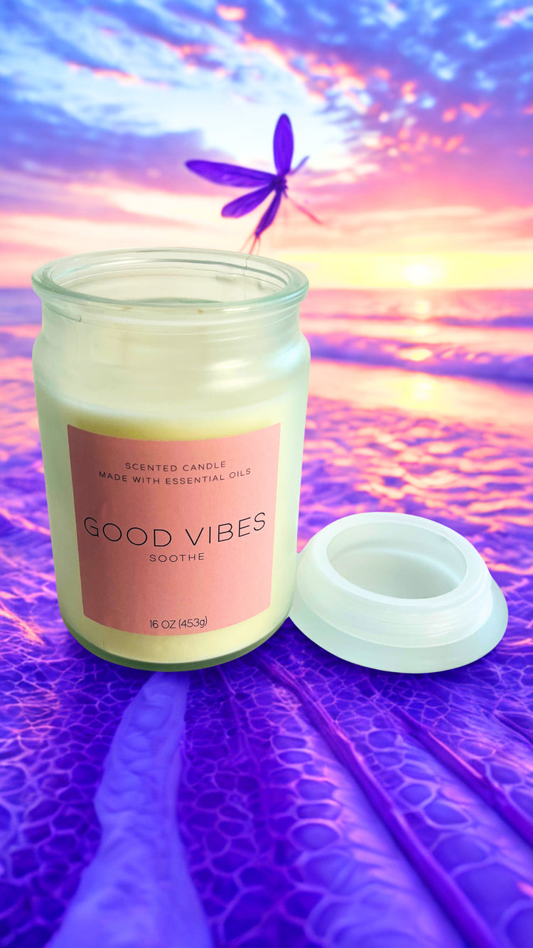 Candle jar labeled 'Good Vibes' with a dragonfly on a colorful abstract background